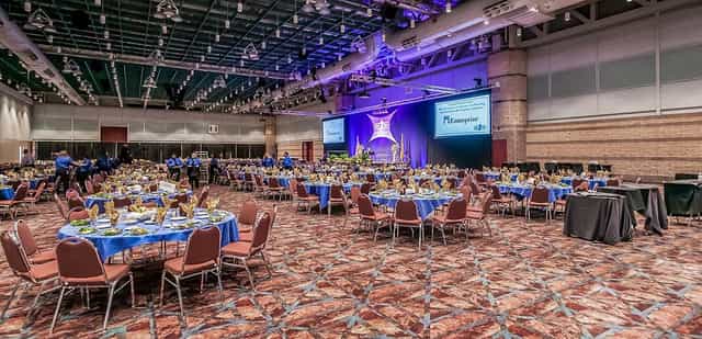 Atlantic City Convention Center exhibit hall with elegant round tables for formal events.