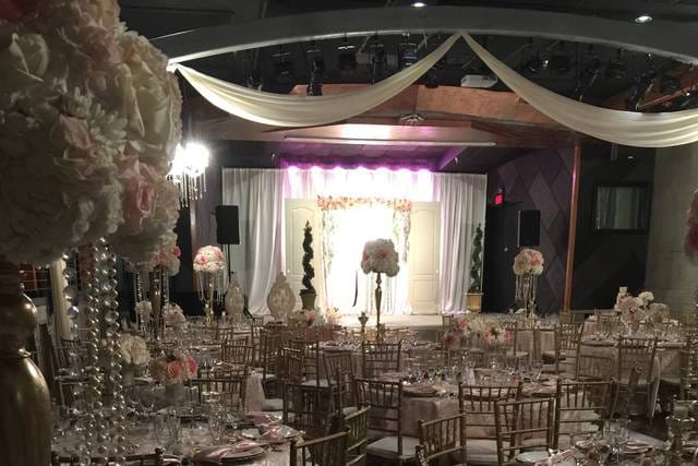 Elegant reception room with floral centerpieces, perfect for weddings and events.