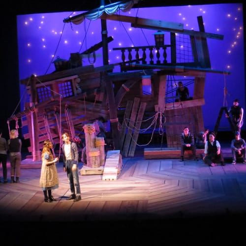 Main Stage Theater at West Valley College with wooden ship backdrop for immersive performances.