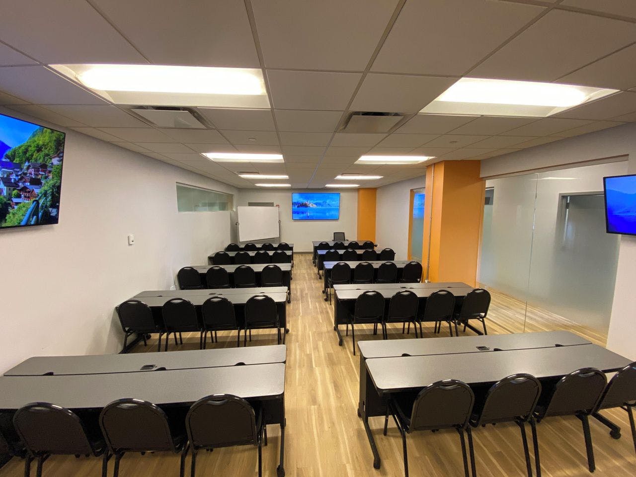 Versatile NYC conference center with dual screens for training sessions and workshops.