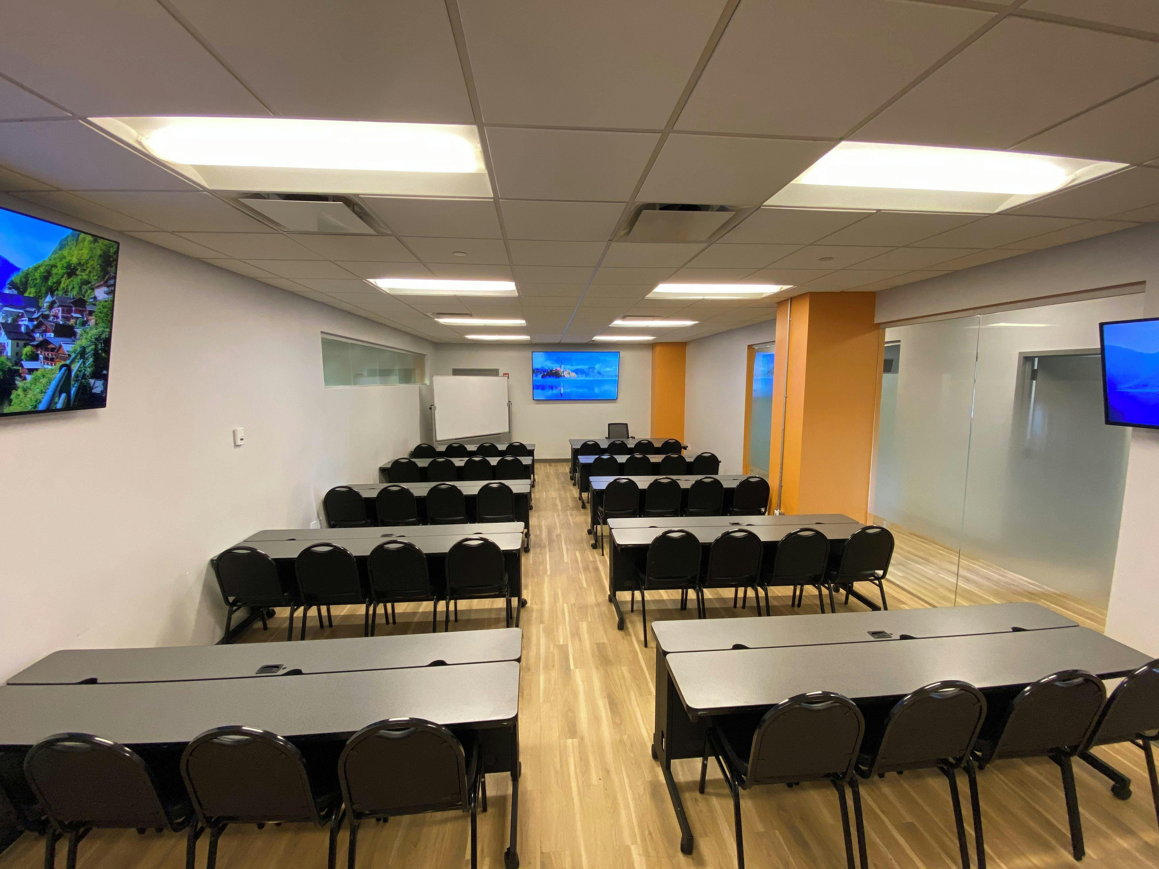 Versatile NYC conference room with tables for workshops and training sessions.