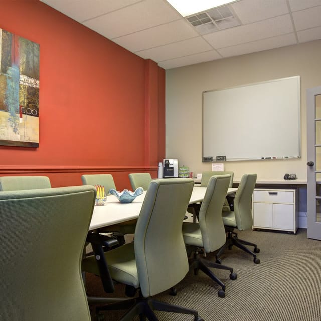 Meeting room with spacious table and chairs for productive business meetings and events.