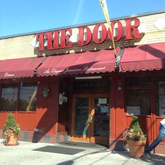 Charming restaurant entrance with inviting awning, perfect for intimate gatherings and events.