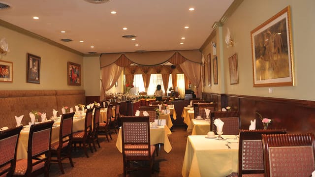 Elegant restaurant space with warm lighting for intimate meetings and events.