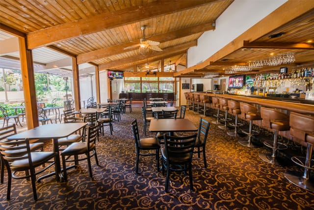 Outdoor venue at Los Gatos Lodge with warm wood accents for casual meetings and events.