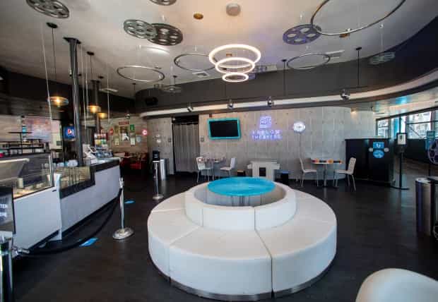 Modern café with circular lighting, perfect for intimate meetings and casual events.