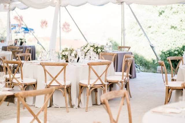 Elegant event tent with round tables at Nella Terra Cellars for weddings and gatherings.