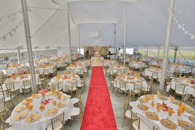 Elegant event tent with round tables at Nella Terra Cellars for weddings and corporate events.