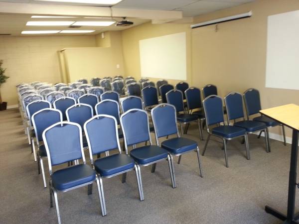 Fremont Meeting Room with blue chairs, ideal for presentations and seminars.