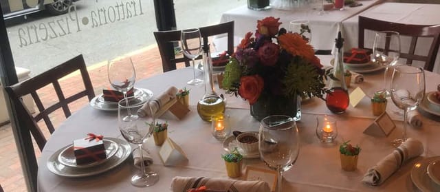 Elegant dining table with floral centerpieces for a sophisticated event at Solo Trattoria.