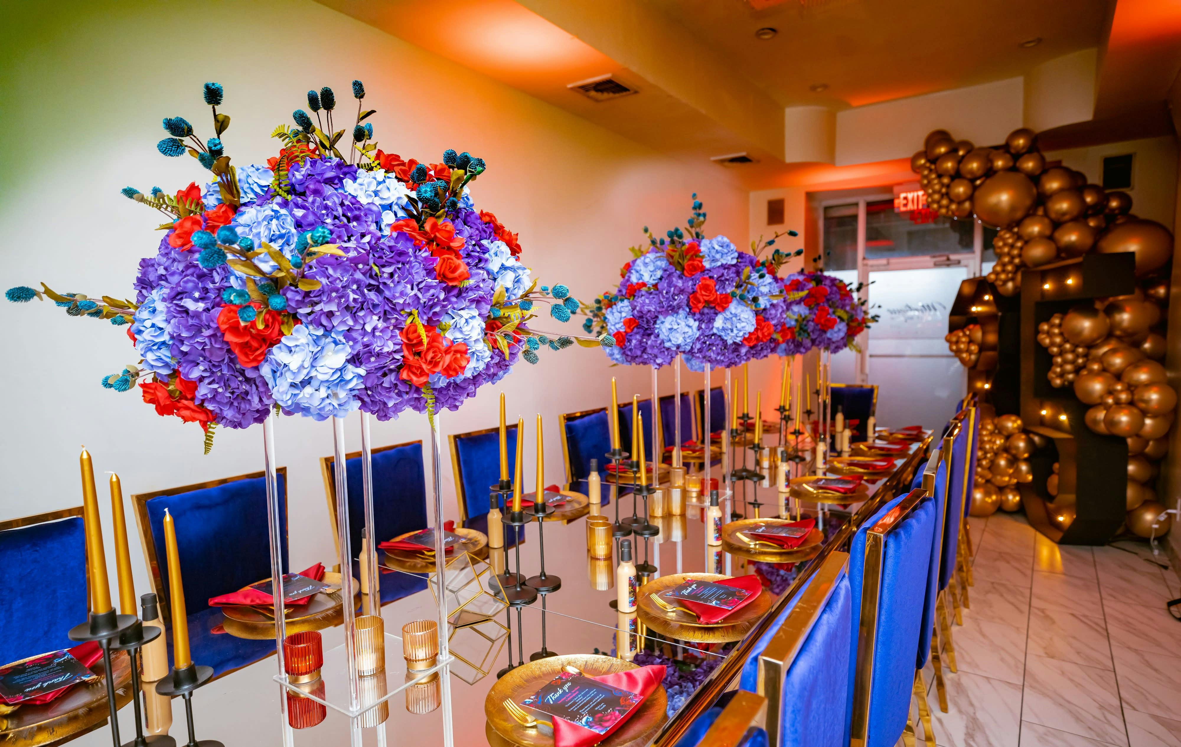 Elegant event space with floral centerpieces, ideal for weddings and corporate events.