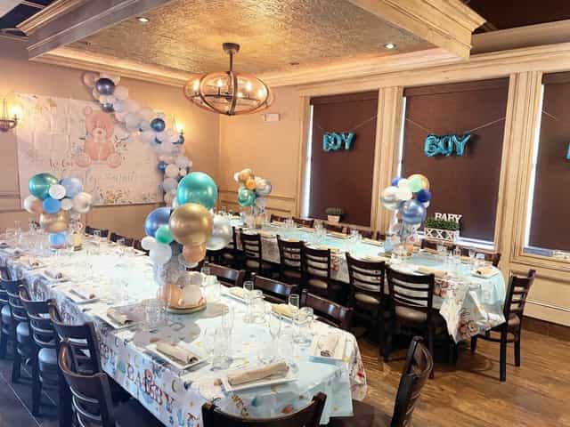 Elegant baby shower setup with soft balloons and teddy bears at Aunt Butchie's, Brooklyn.