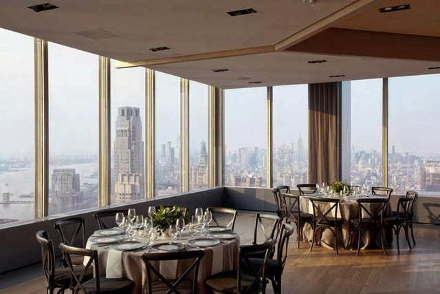 Elegant event space at The Shed, featuring panoramic city views for upscale gatherings.