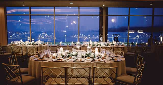 Elegant ballroom with round tables, perfect for weddings and corporate galas.