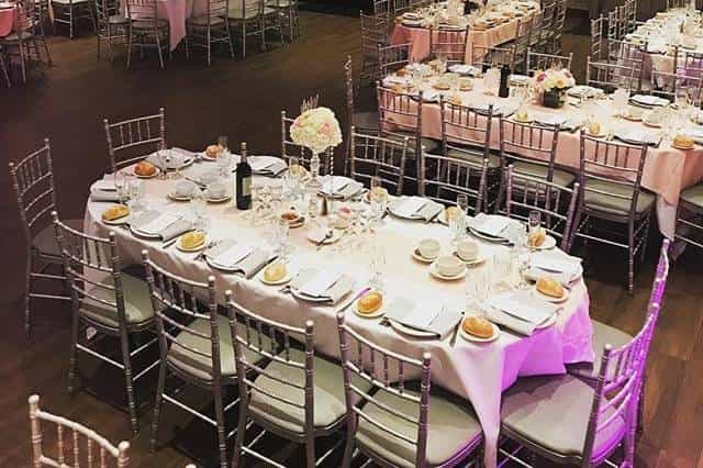 Elegant banquet hall with silver chiavari chairs, perfect for weddings and corporate events.