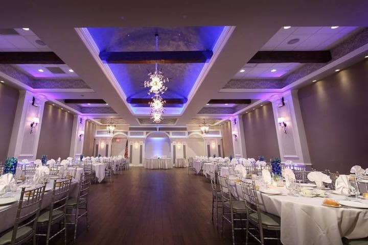 Elegant banquet room with round tables, perfect for corporate events and celebrations.