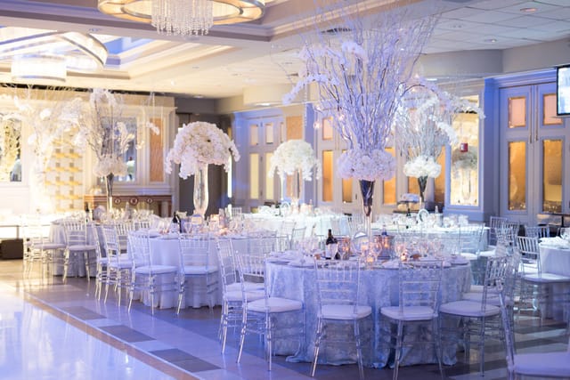Elegant Encore Ballroom with floral centerpieces, perfect for weddings and corporate events.