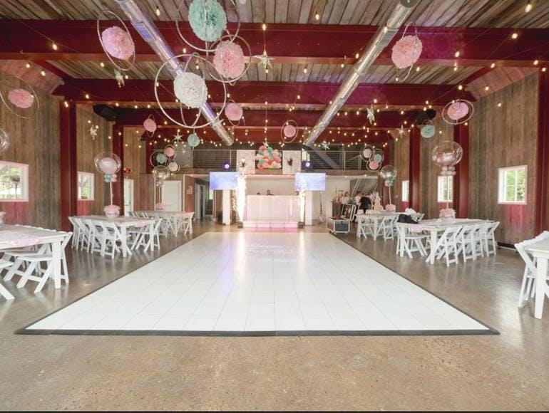 Outdoor party space with spacious dance floor, ideal for weddings and corporate events.