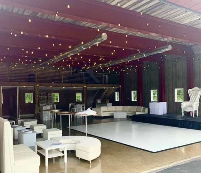Outdoor party space with modern furnishings and ambient lighting for events and celebrations.