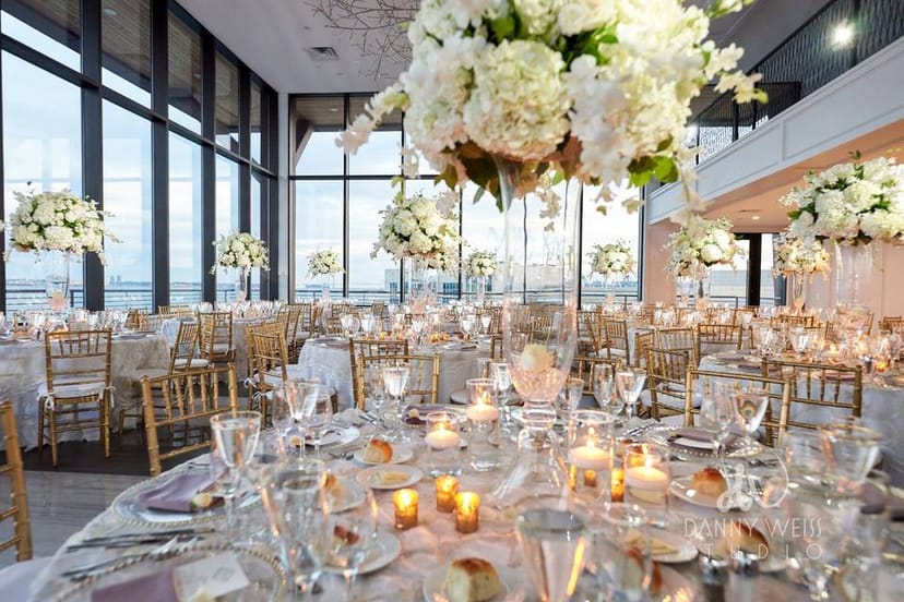 Elegant banquet hall at Hudson House with floral centerpieces, perfect for weddings and events.