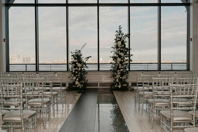 Elegant dance floor at Hudson House with waterfront view, ideal for weddings and events.