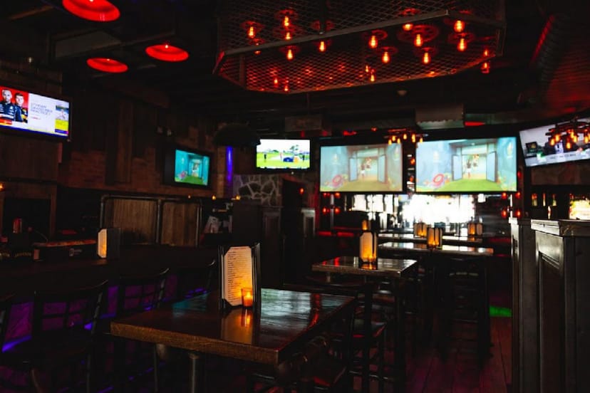 Vibrant restaurant event space with modern decor, ideal for networking and gatherings.