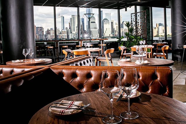 Indoor dining area at Lokal Eatery & Bar with leather seating, ideal for corporate events.