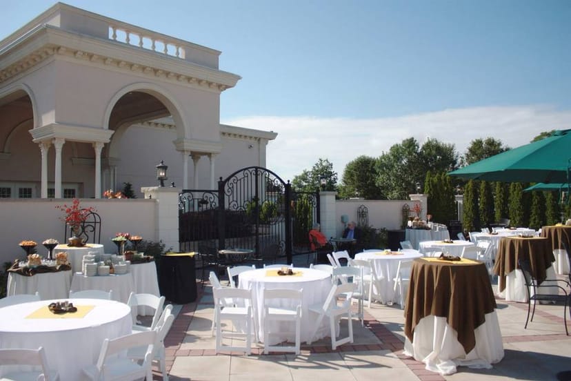 Elegant Bridal Suite at Jacques Reception Center with round tables, ideal for outdoor receptions.