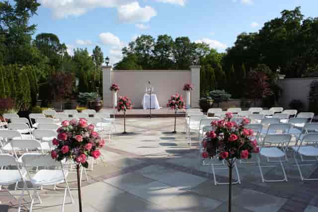 Outdoor wedding reception at Jacques Reception Center with elegant floral arrangements.
