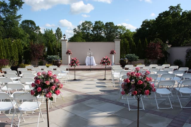 Outdoor wedding reception at Jacques Reception Center with elegant floral arrangements.