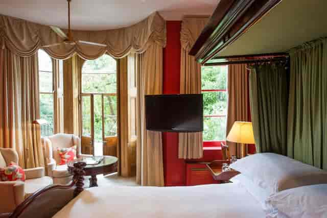 Elegant hotel room with natural light, perfect for meetings and retreats at The Portobello Hotel.