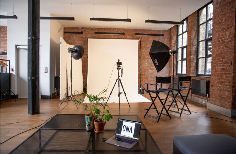 Versatile event space with exposed brick, ideal for creative meetings and photo shoots.