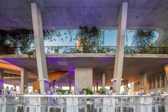 Modern event space with large windows, ideal for corporate gatherings and upscale dinners.
