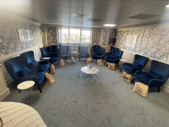 Silver Room at Wilmslow Conference Centre with plush blue chairs for meetings and events.
