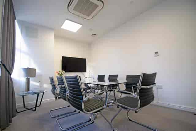 Modern meeting room at Grosvenor House, ideal for presentations and small gatherings.