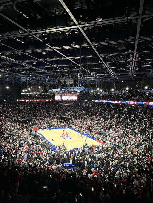 Packed basketball court at Accor Arena during a high-energy game, showcasing sports marketing.
