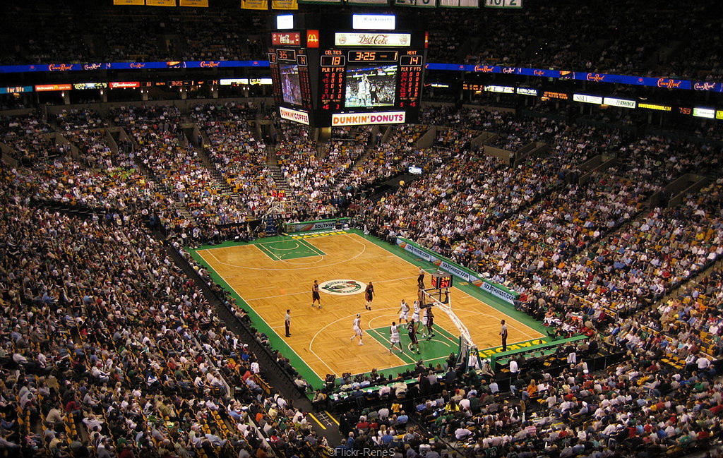 Packed basketball court at Accor Arena during a live sports event.