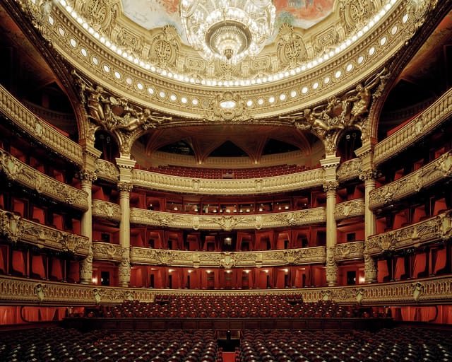 Amphitheatre in Palais Garnier, Paris: ornate architecture for elegant events and performances.