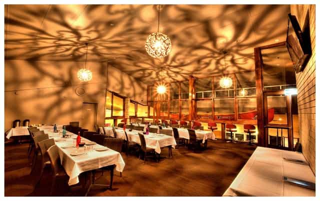 Elegant event space at Jewells Tavern with warm lighting, perfect for corporate dinners.