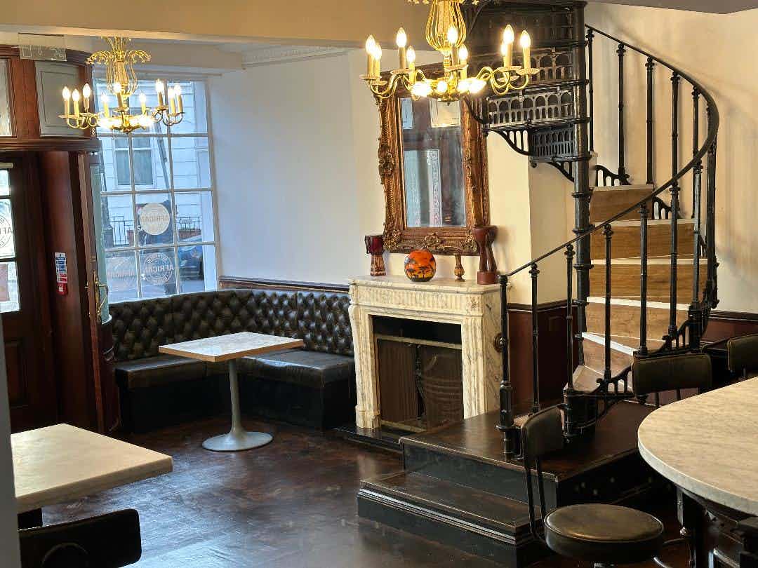 Elegant event space at The Calabash Restaurant with cozy seating and natural light. - Banner