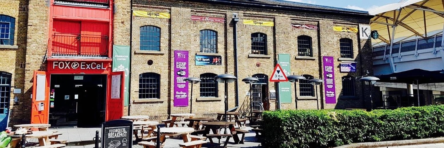 Vibrant Warehouse Bar with picnic tables, perfect for casual gatherings and networking events.