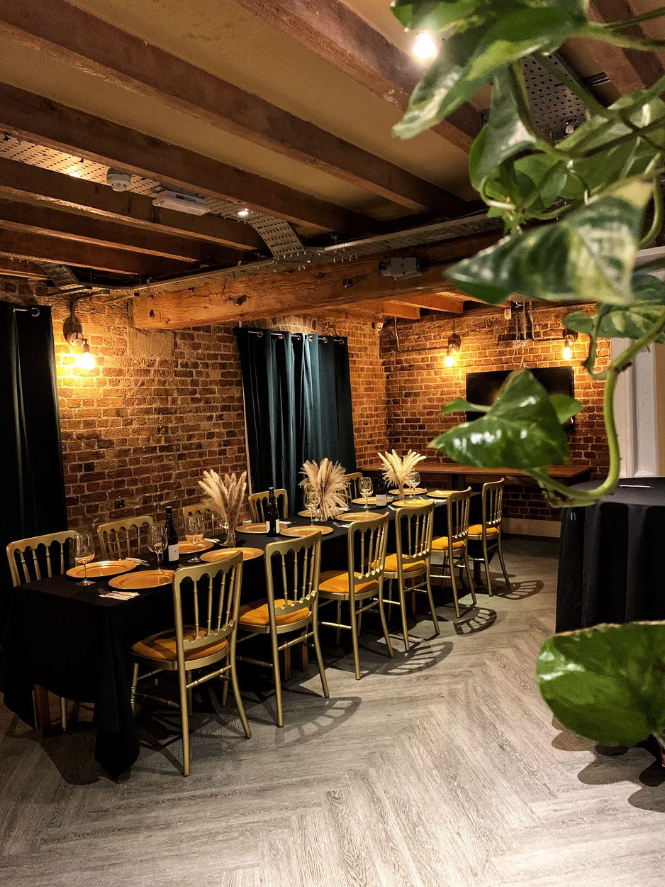 Stylish Warehouse Bar with exposed brick, perfect for private dinners and gatherings.