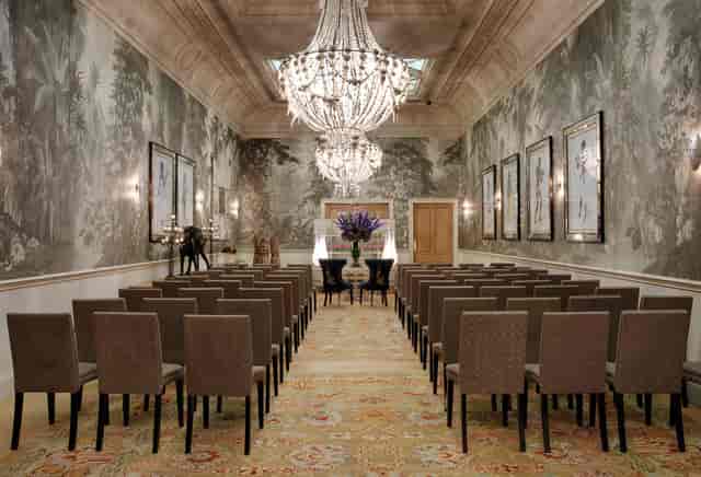 Elegant Nash Room at Haymarket Hotel, perfect for seminars with chandeliers and floral decor.