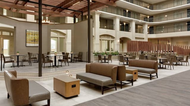 Elegant atrium at Embassy Suites Milpitas, ideal for networking events and meetings.
