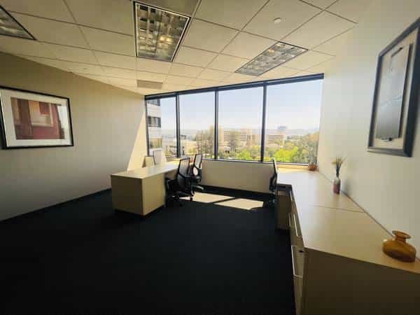 Modern training room with large windows at SpringHill Suites San Jose Airport.