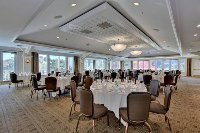 Elegant private conference room with round tables, ideal for corporate meetings and banquets.