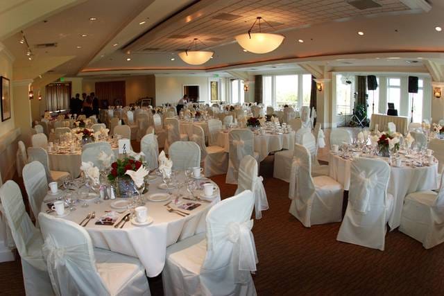Elegant Wedding Pavilion banquet hall with round tables, ideal for weddings and events.