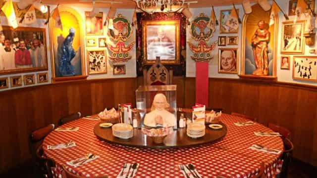 Dining area with round table and checkered tablecloth for private events at Buca di Beppo.