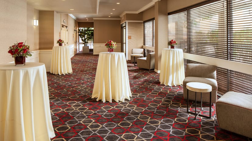 Event space at Four Points by Sheraton, elegant high-top tables for networking gatherings.