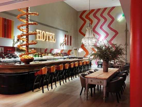 Vibrant Dive Bar at Ham Yard Hotel, ideal for networking events and casual meet-ups.